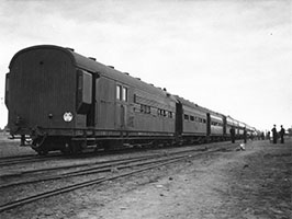 1954 - view of The Ghan in station yard - brake NHR30 on rear